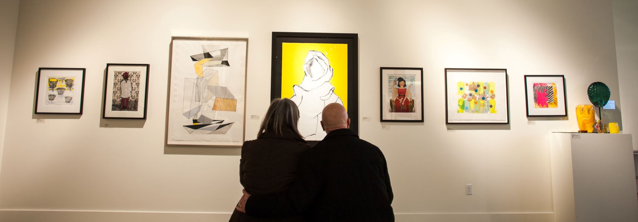 Couple enjoying artwork on the walls of the Schack