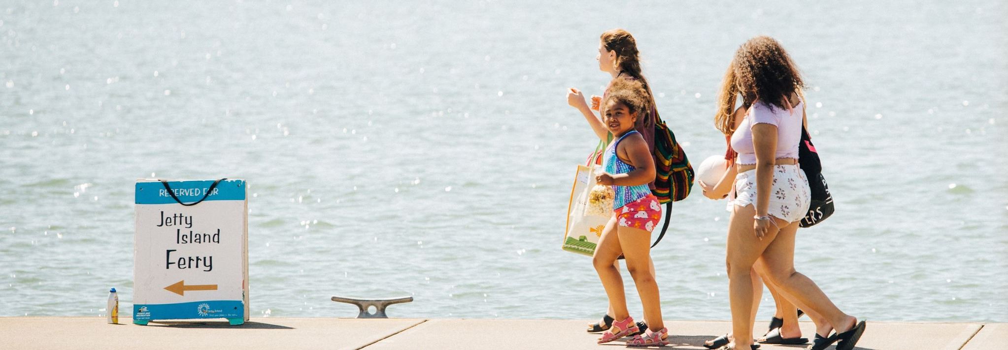 Family walking to Jetty Island ferry
